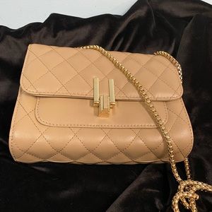 Quilted crossbody purse.